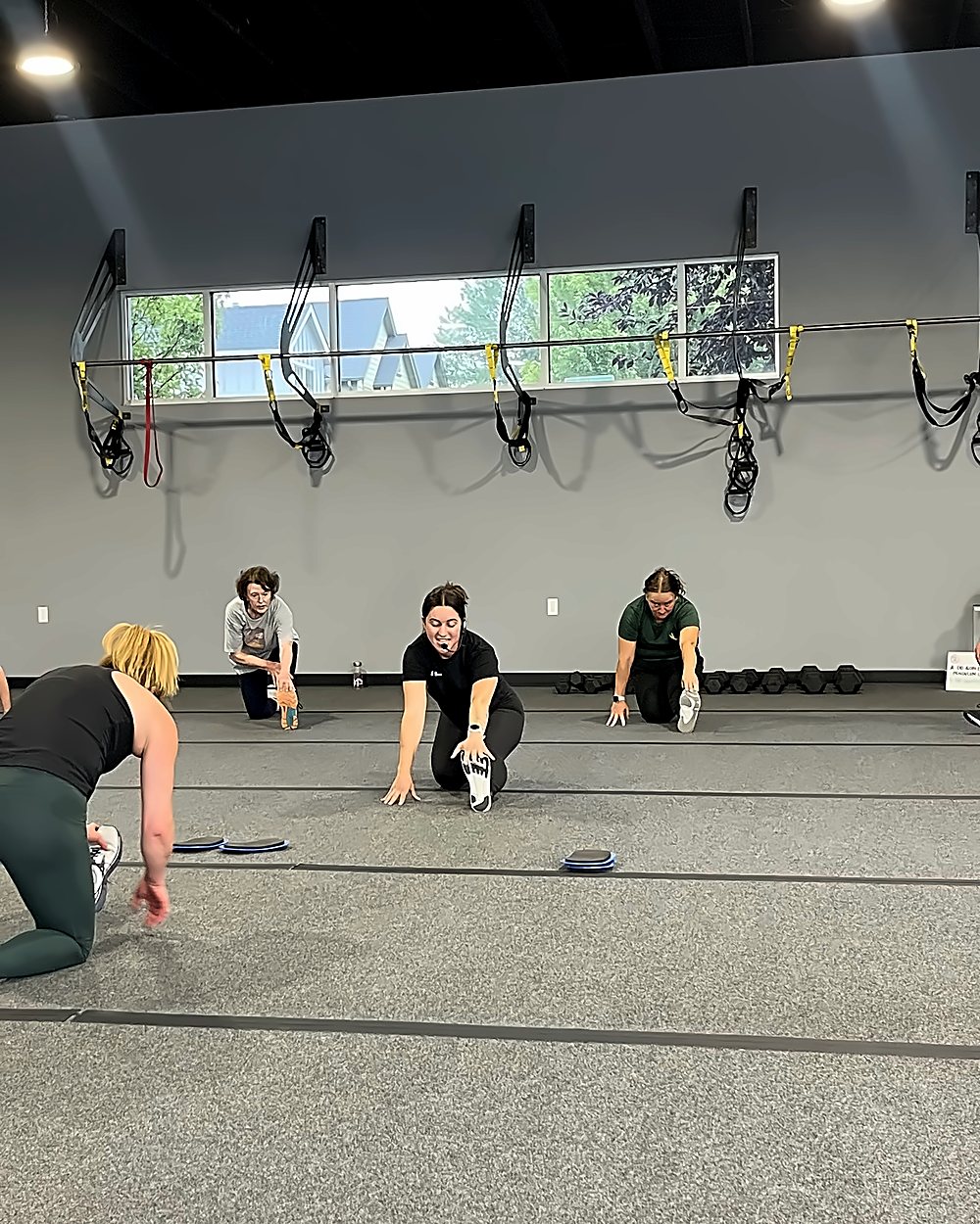 Ritual Training Bend - members working through floor mobility in a coached session