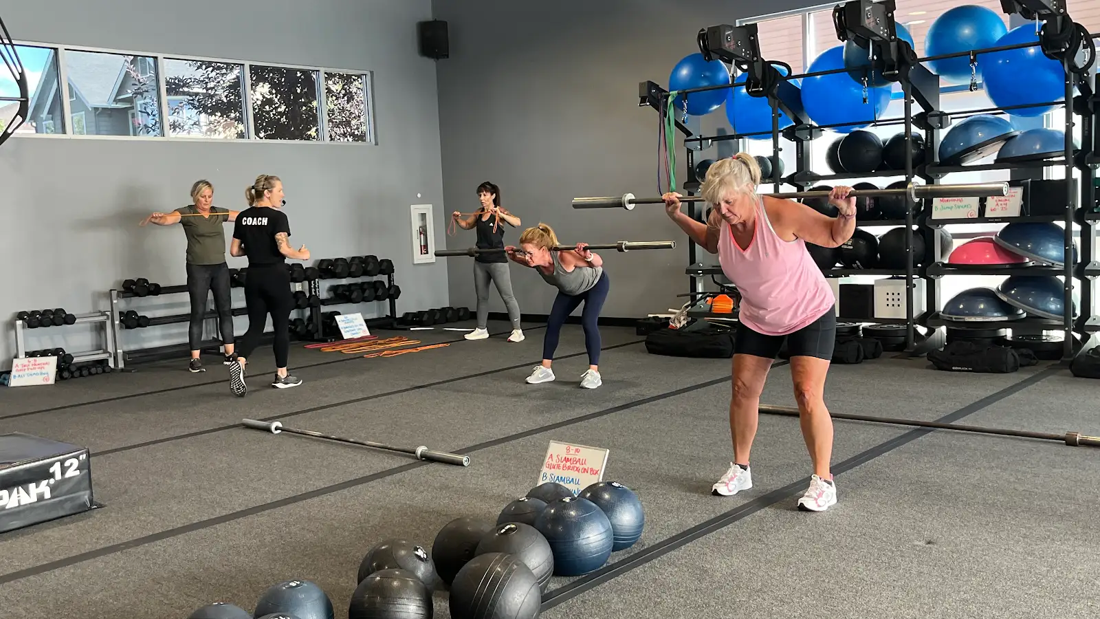 Members training with barbells